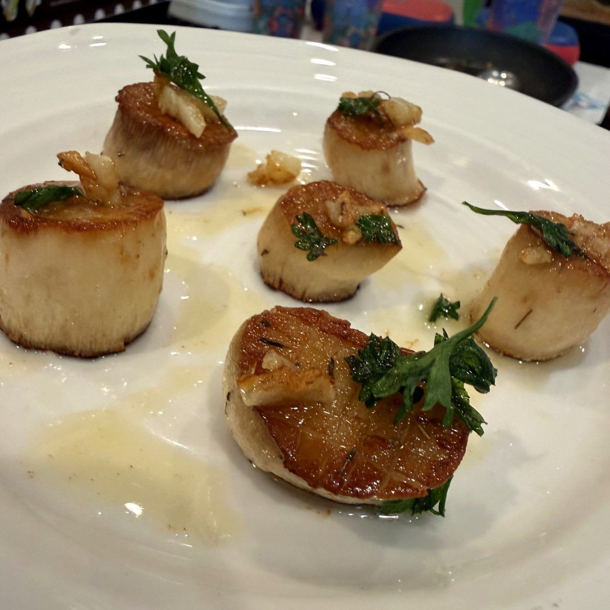 King oyster mushroom rounds seared golden like scallops, with garlic and parsley