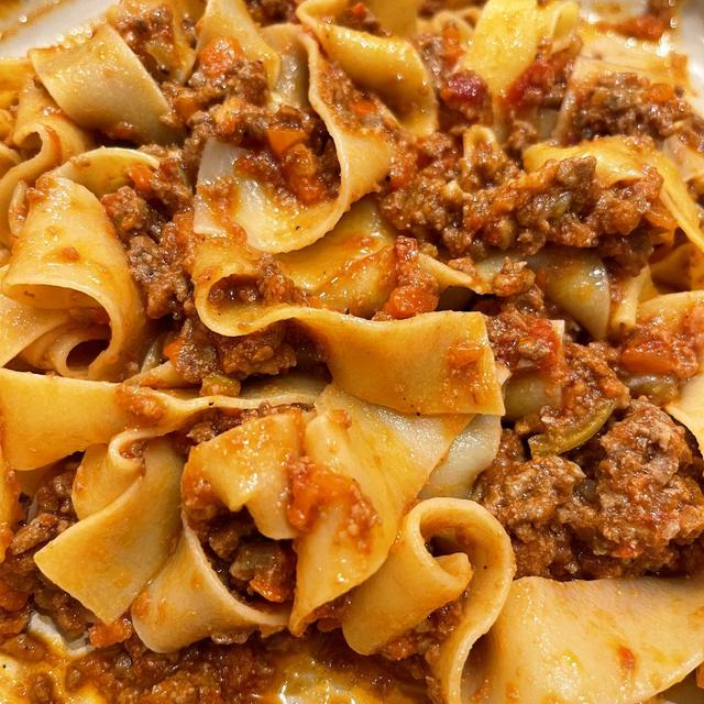 A close-up of a pot of bolognese