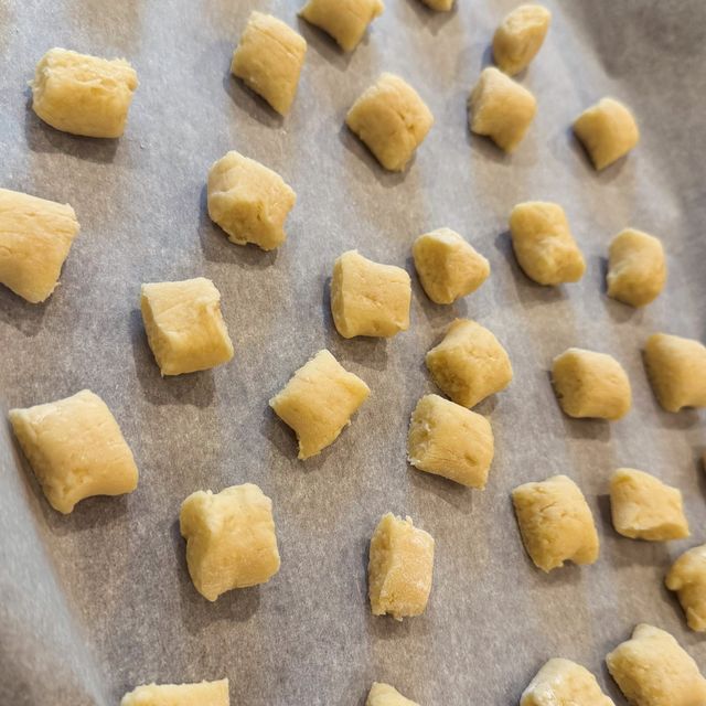 Rows of freshly cut gnocchi on parchment